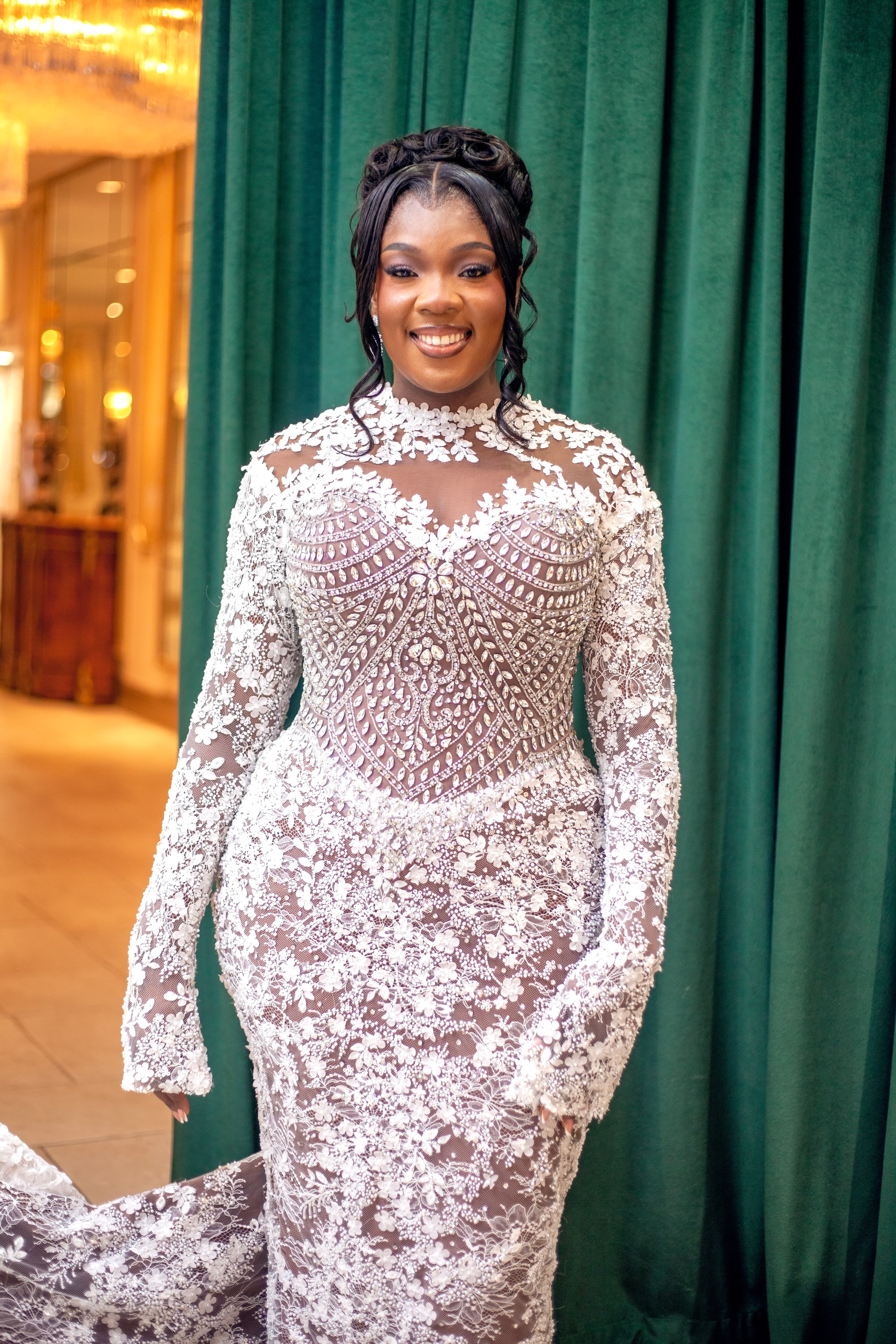 Bride pausing on a staircase before the ceremony